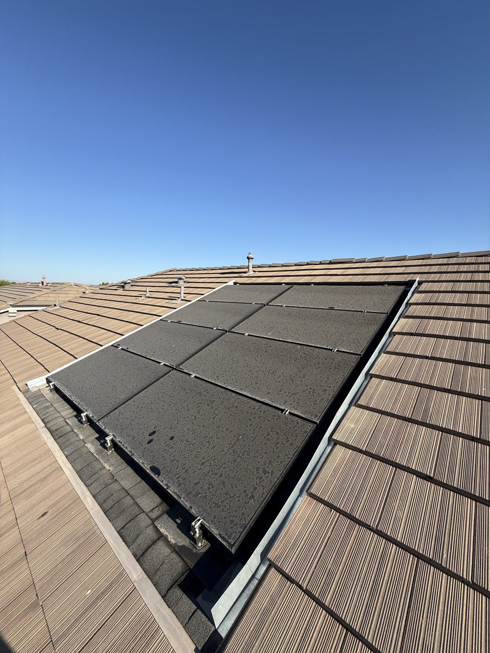 Solar panels dulled by dust and pollen before cleaning