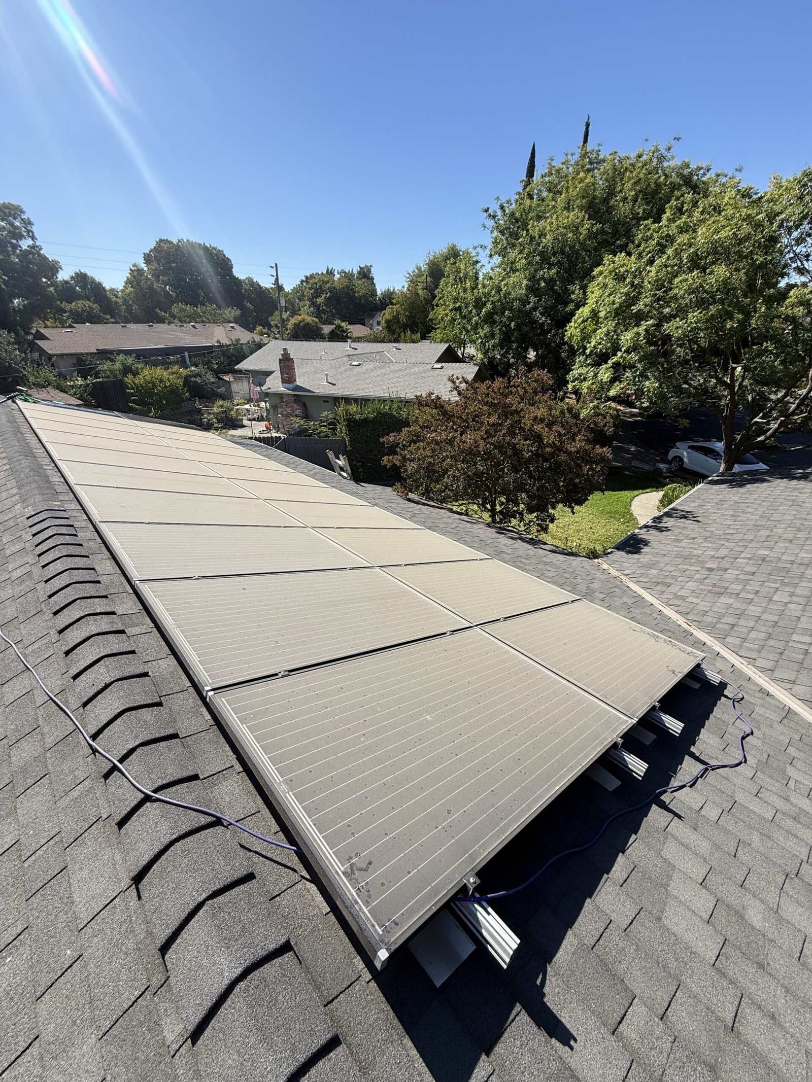 Rooftop solar array coated in dust before cleaning